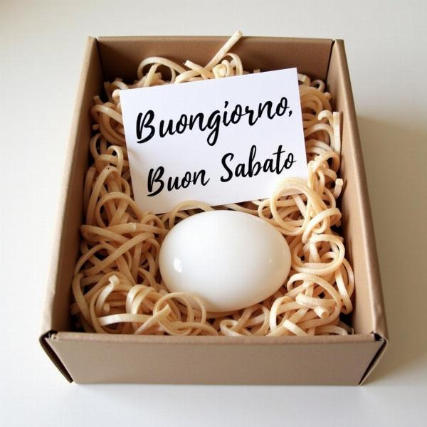 Scatola regalo con una pietra bianca e un biglietto di auguri